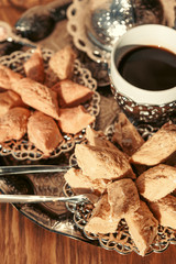 Turkish sweets with coffee on a wooden table