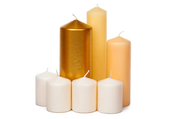 different sized candles on a white background