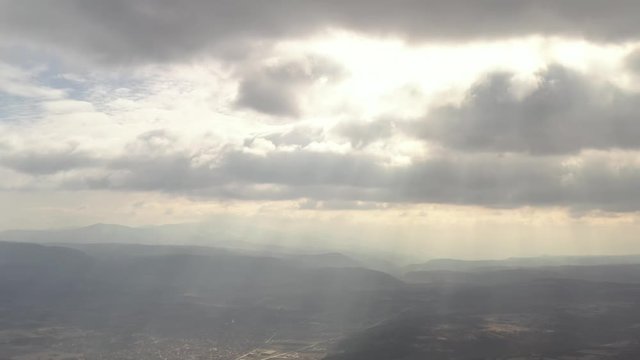 Clouds and sun rays comming through 4K drone video