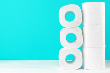 Toilet paper rolls on turquoise bright background