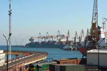Fototapeta premium Odessa seaport, Odessa, Ukraine. Cranes and ships in the port against a background of blue sky.