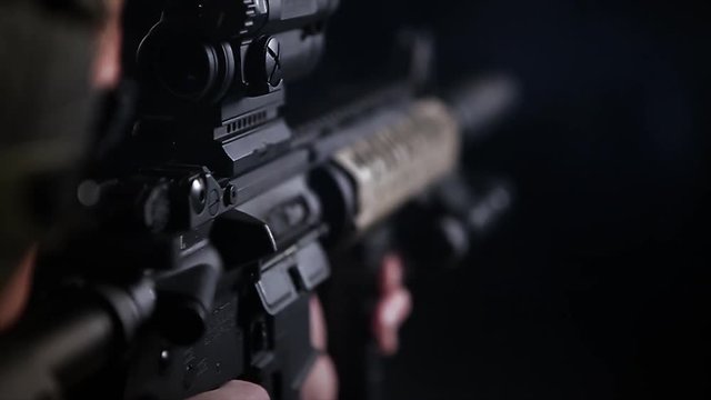 Close Up Of Man Firing Artillery Rifle