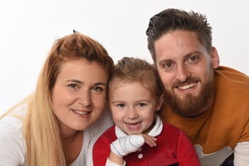 couple with child with his bandaged hand