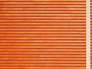 Obraz premium orange metal security roller door background