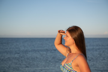 Naklejka premium Young woman on the beach