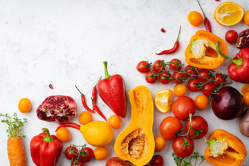 Flatlay with colorful vegetables and copy space arranged on white background. View from above. Vegan nutrition concept