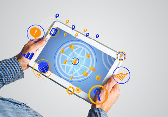 Hands of businessman holding tablet pc with social connection concept