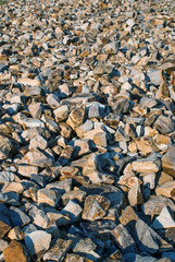big stones lie on the beach