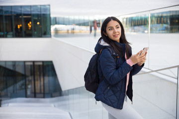 Inspired lady blogger making notes in smartphone