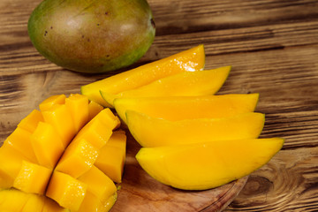 Fresh mango fruit on wooden table