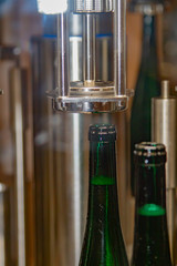 in a winery wine gets bottled automatically in a filling station