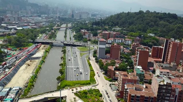 Flying over roads full of cars in Medellin, aerial 4k