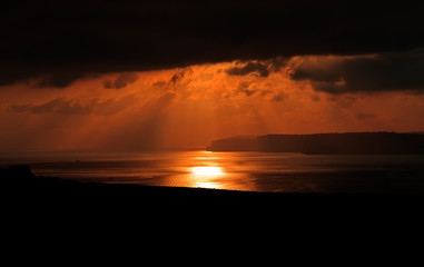Tawny Sunset over Gozo, taken from Malta by the Red Tower