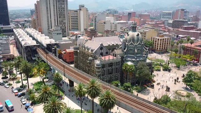 Slow aerial shot of Plaza Botero, Medellin Colombia