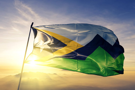 Aileu municipality of East Timor flag waving on the top sunrise mist fog