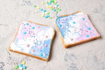 Unicorn or mermaid toasts with stars, food for kids idea, close up