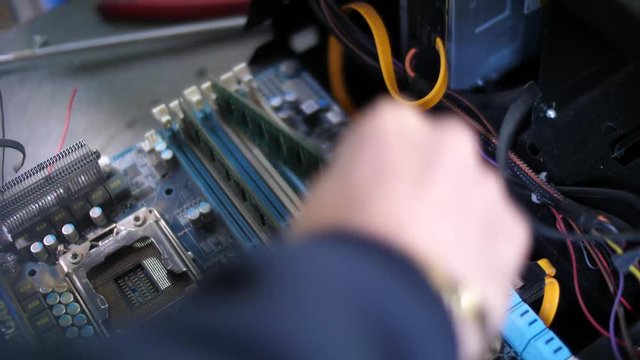 Removing of RAM memory module sticks from computer. Close up