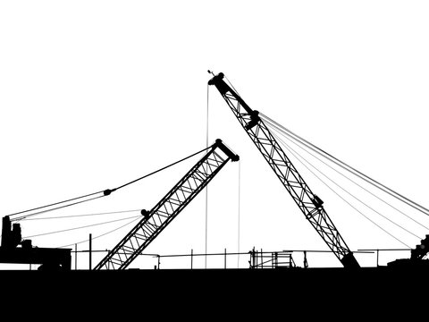 silhouette cranes on the construction site