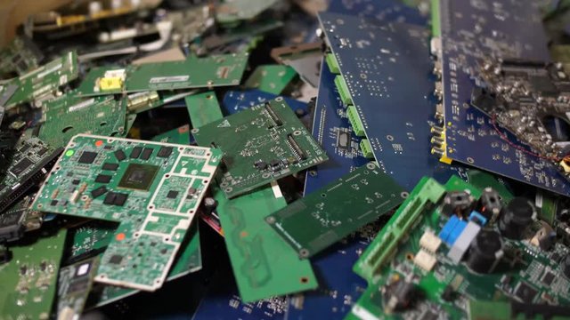 Close up of comuter modules being sorted during recycling process