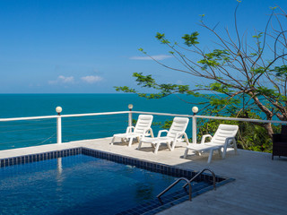 Fototapeta premium Swimming pool with palm trees