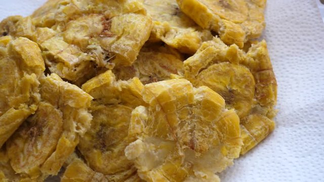 Smashed fried  Bananas for Tachinos slide slow motion. 5