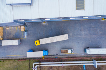 Aerial Top View of White Semi Truck with Cargo Trailer Parking