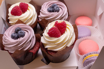 cupcakes with cream and berries