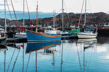 The fishing boat moored in a jettie in Lochinver Marina