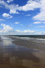 Empty sandy beach and horizon on the Norfolk coast UK