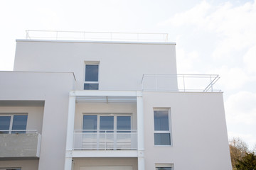 Detail of a new modern white apartment building