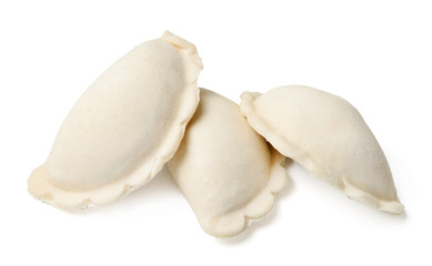 Three mouth-watering dumplings. White isolated background. Side view. Close-up.