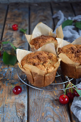 Muffin from flax seeds, millet and rice flour with cherries. Homemade baking. Organic healthy vegetarian food. Gluten free. Dairy free. Grain free pastries. Rustic photo. Copy space.