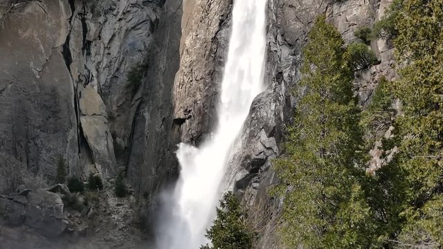 Lower Yosemite Falls at Yosemite National Park with strong water flow.