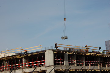 construction of a multistory residential concrete building and cargo in the air