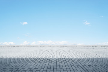 Empty cement floor with blue sky