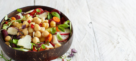 Chickpea salad with vegetables and microgreens