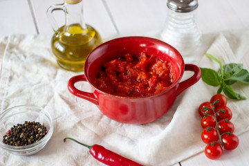 Chopped tomatoes with olive oil. Top view.