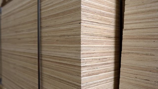Elements from plywood stacked on pallets in the carpentry warehouse