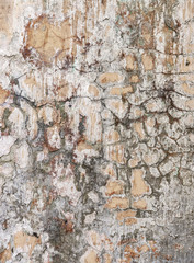Old cracked paint on the concrete wall. Peeling paint on wall texture. Pattern of rustic blue grunge material