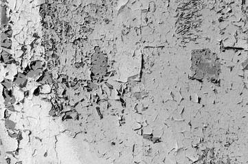 Old cracked paint on the concrete wall. Peeling paint on wall texture. Pattern of rustic blue grunge material