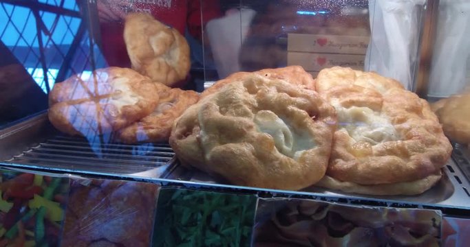 Langos, the hungarian traditional food speciality in a food stand in the Great Market Hall.