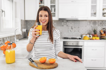 Young woman sitting a table in the kitchen