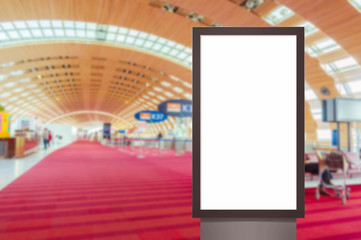 mock up of vertical blank advertising billboard or light box showcase with people waiting at airport, copy space for your text message or media content, advertisement, commercial marketing concept