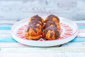 Profiterole with vanilla and chocolate sauce