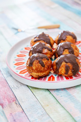 Profiterole with vanilla and chocolate sauce