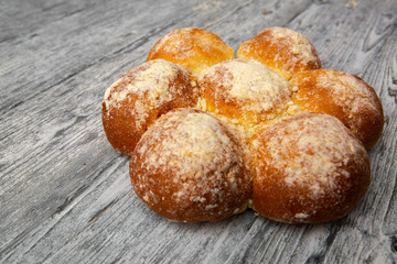 fresh homemade buns on wooden background