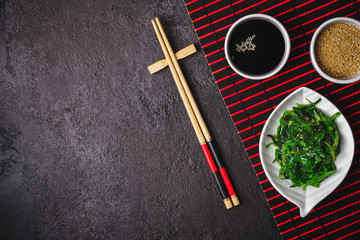 Fototapeta na wymiar Japanese Cuisine Chuka Seaweed Salad. Asian Japanese table setting