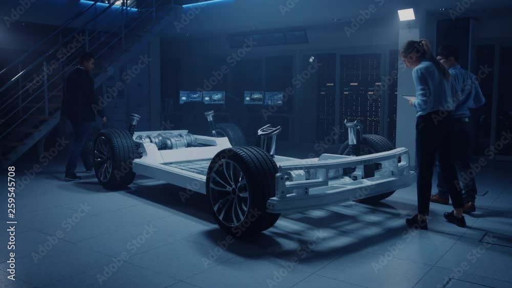 Leinwandbilder automobile design engineers working on electric car platform chassis prototype, using cad software f