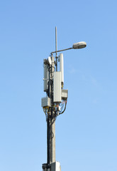 Communications tower and street light with sky