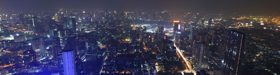 Obraz premium Bangkok, Thailand- December 31, 2018 ; Bangkok night skyscraper from rooftop of The Kingpower Mahanakorn Tower under dust pollution.